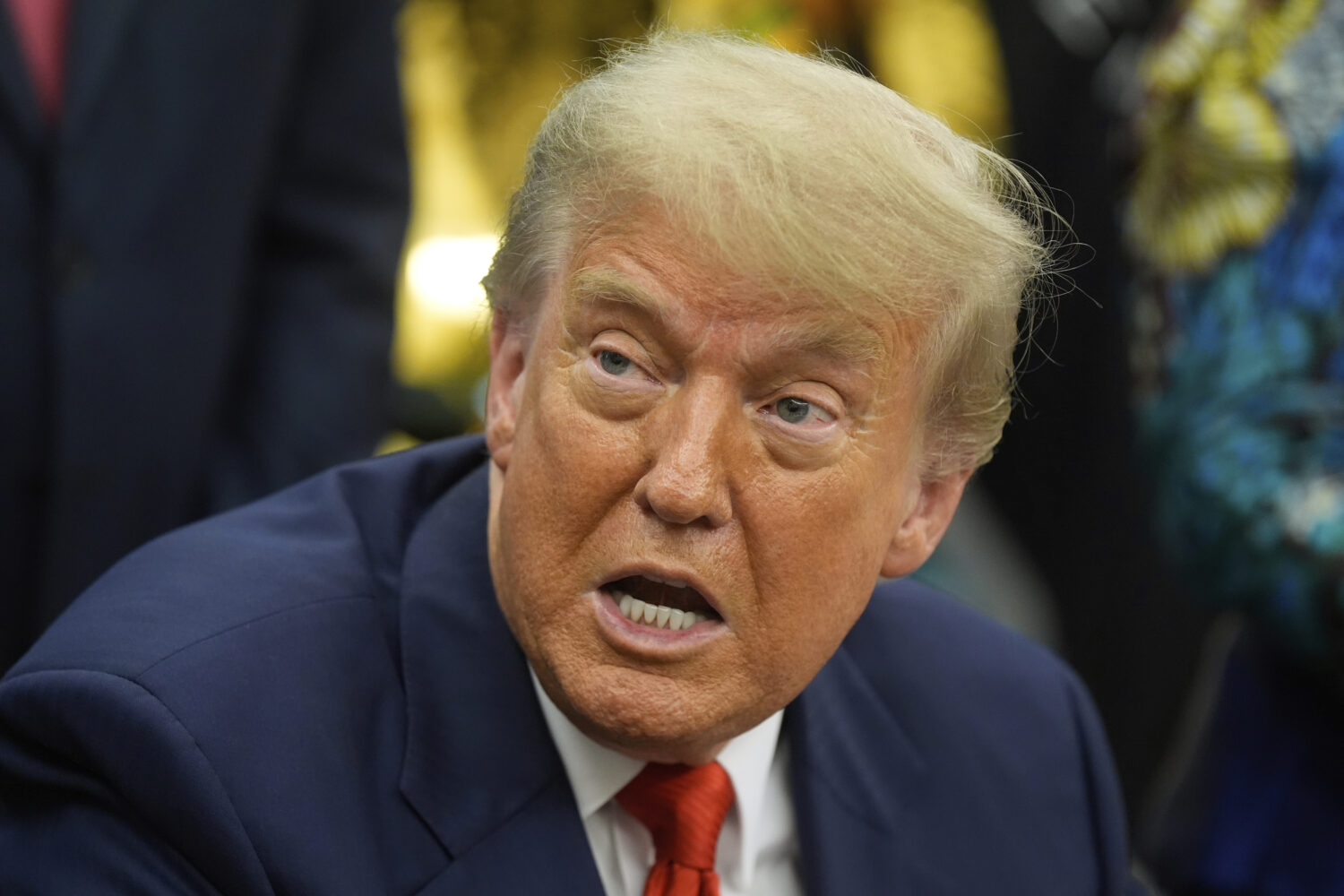 President Donald Trump answers questions from reporters as he meets with Congo's Foreign Minister T...