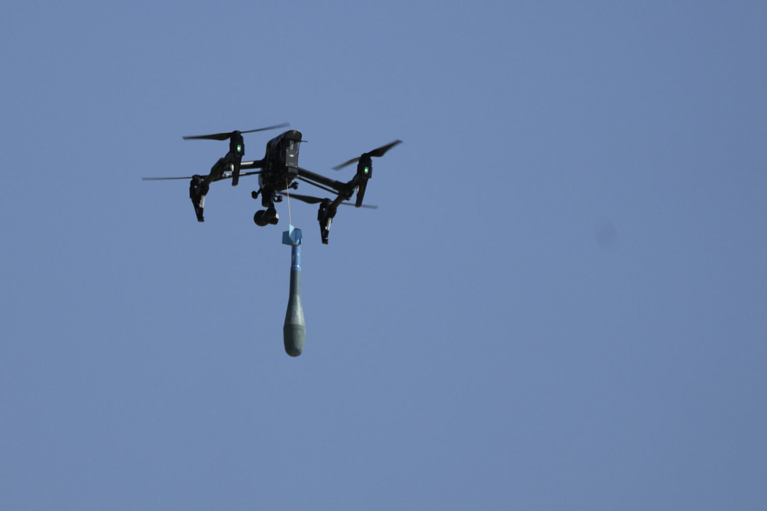 FILE - A drone carries a mortar shell as soldiers take part in the U.S.-led Immediate Response 25 m...