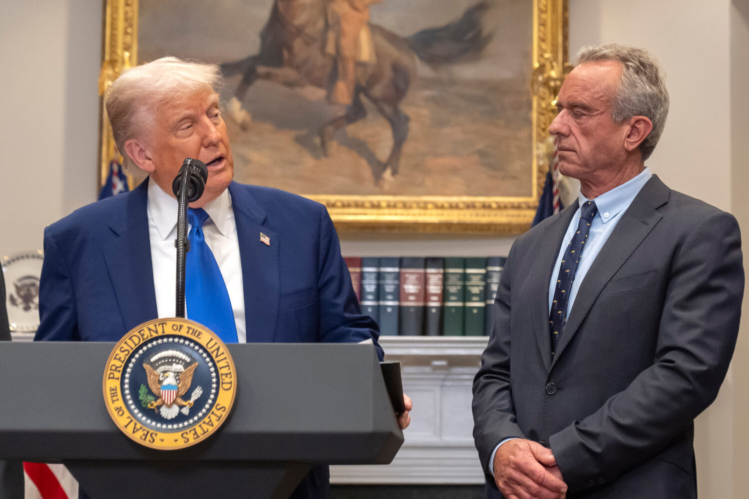 FILE - President Donald Trump, from left, speaks as Health and Human Services Secretary Robert F. K...