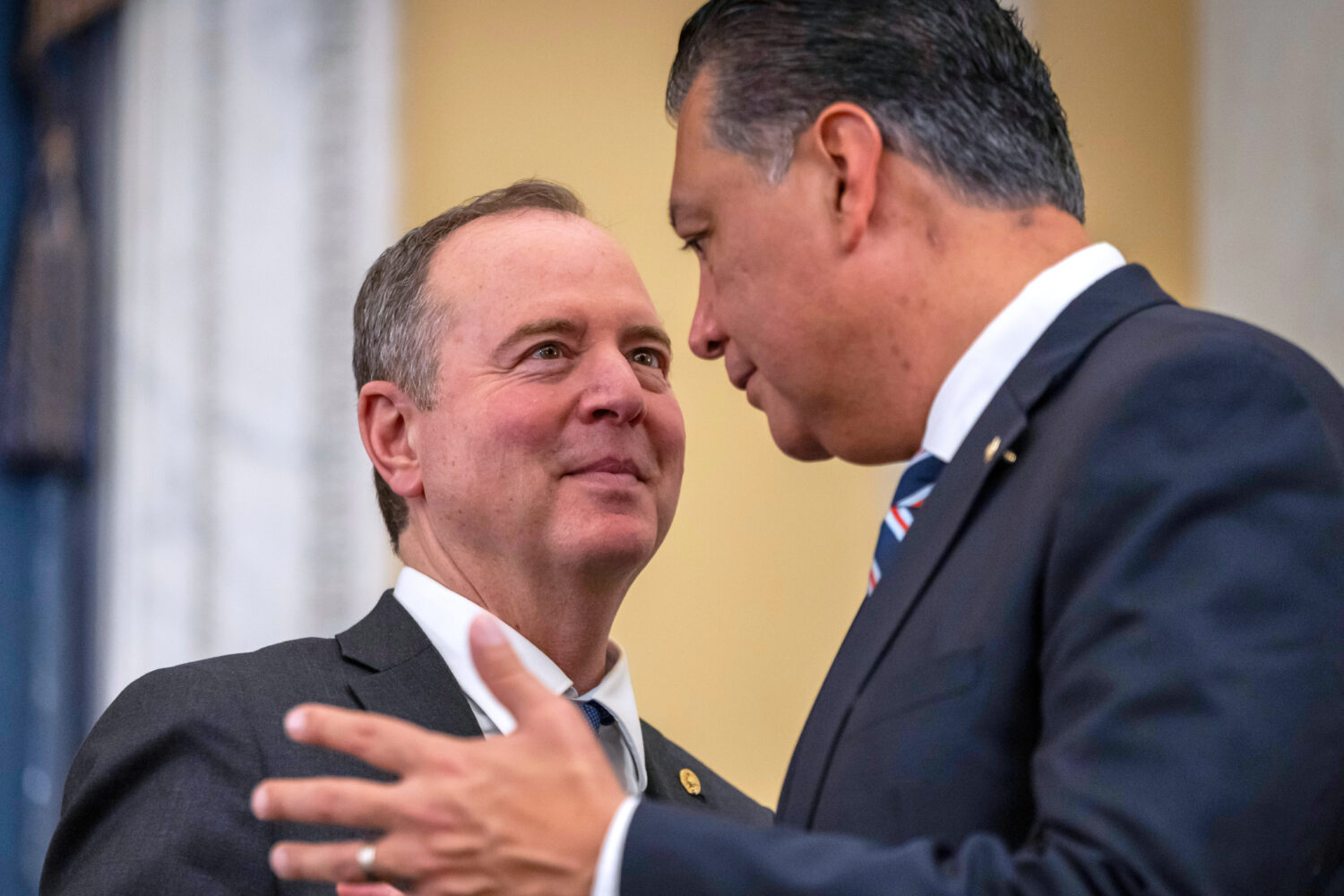 FILE - Sen. Adam Schiff, D-Calif., left, speaks with Sen. Alex Padilla, D-Calif., right, during a S...