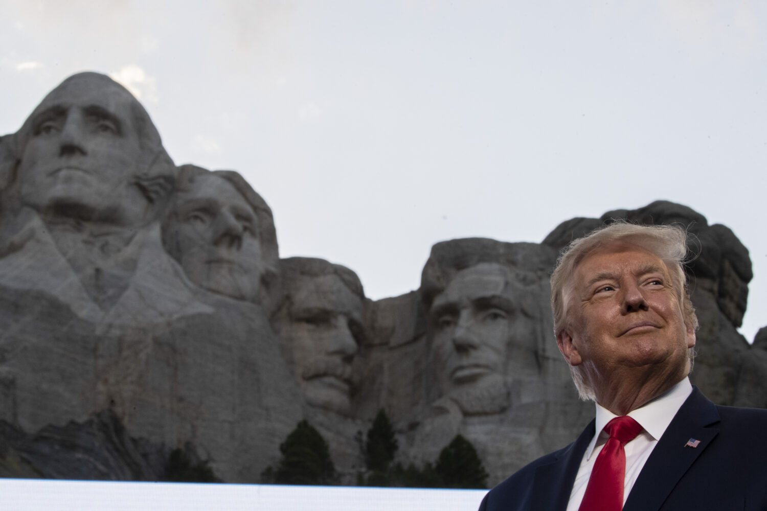 FILE - Then-President Donald Trump stands at Mount Rushmore National Memorial on July 3, 2020, near...