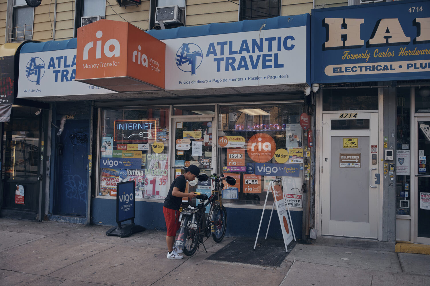 A young man arrives at a travel agency on Thursday, June 5, 2025, in the Brooklyn borough of New Yo...