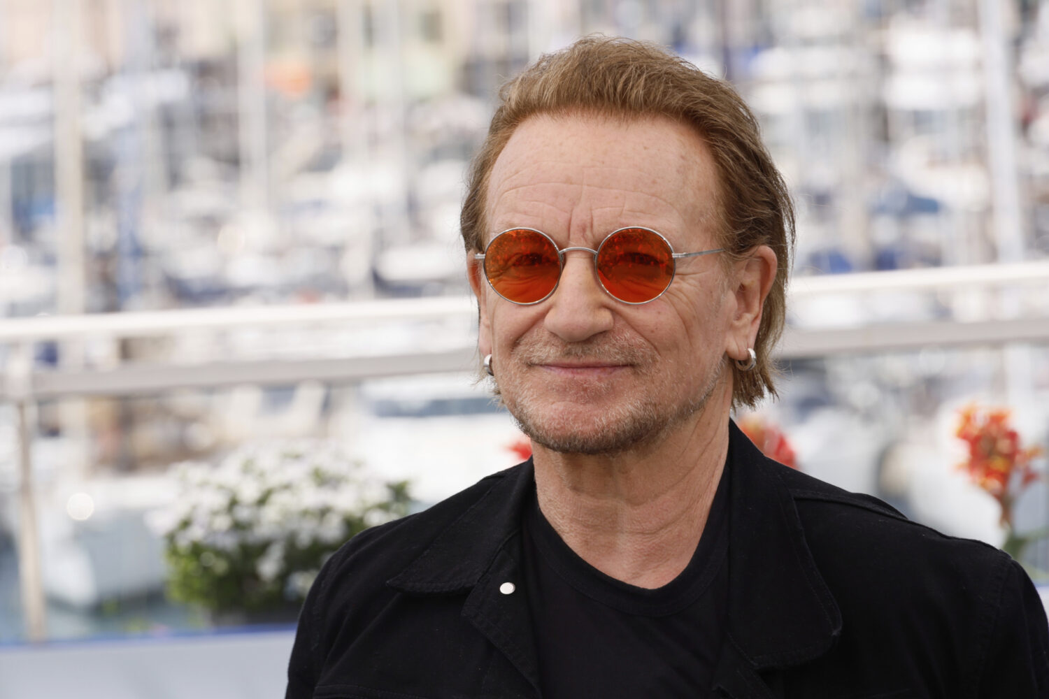 FILE - Bono poses for photographers at the 78th international film festival, Cannes, southern Franc...