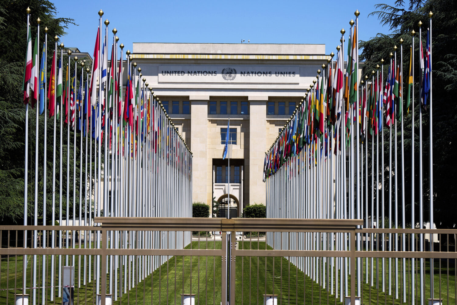 FILE - Flagpoles line in rows in front of a building of the United Nations in Geneva, Switzerland, ...