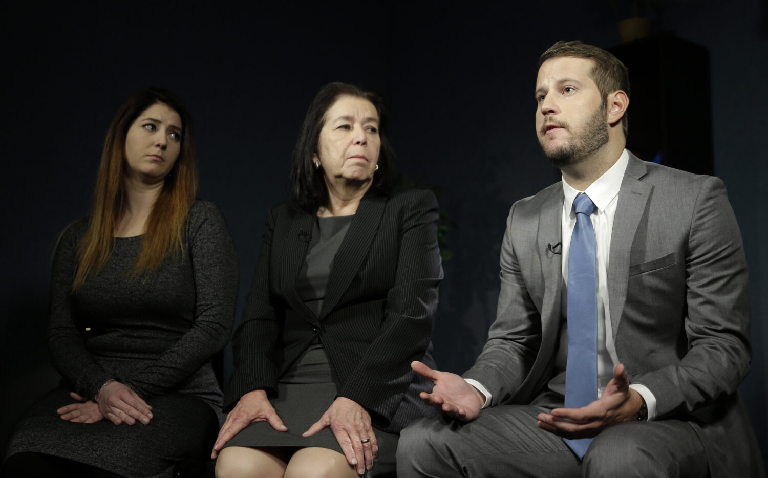 FILE - Christine Levinson, center, wife of Robert Levinson, and her children, Dan Levinson, right, ...