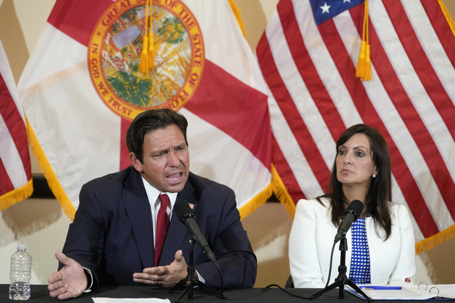 FILE - Florida Gov. Ron DeSantis gestures as he and Lt. Gov. Jeanette Nuñez, answer questions afte...