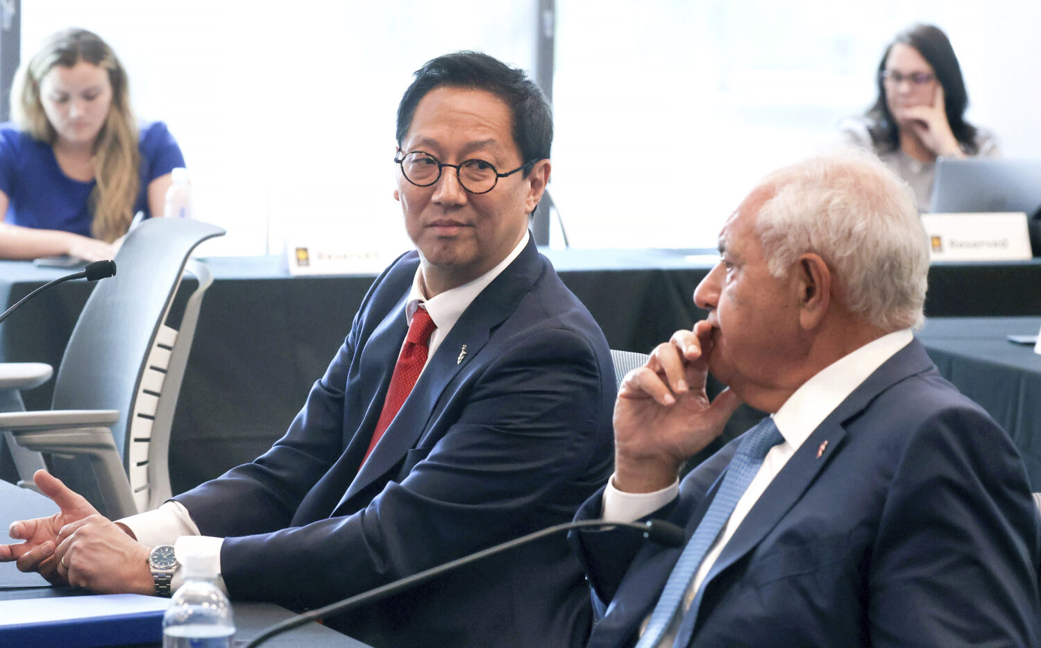 University of Florida president-elect Santa Ono glances at Mori Hosseini, right, chairman of the UF...