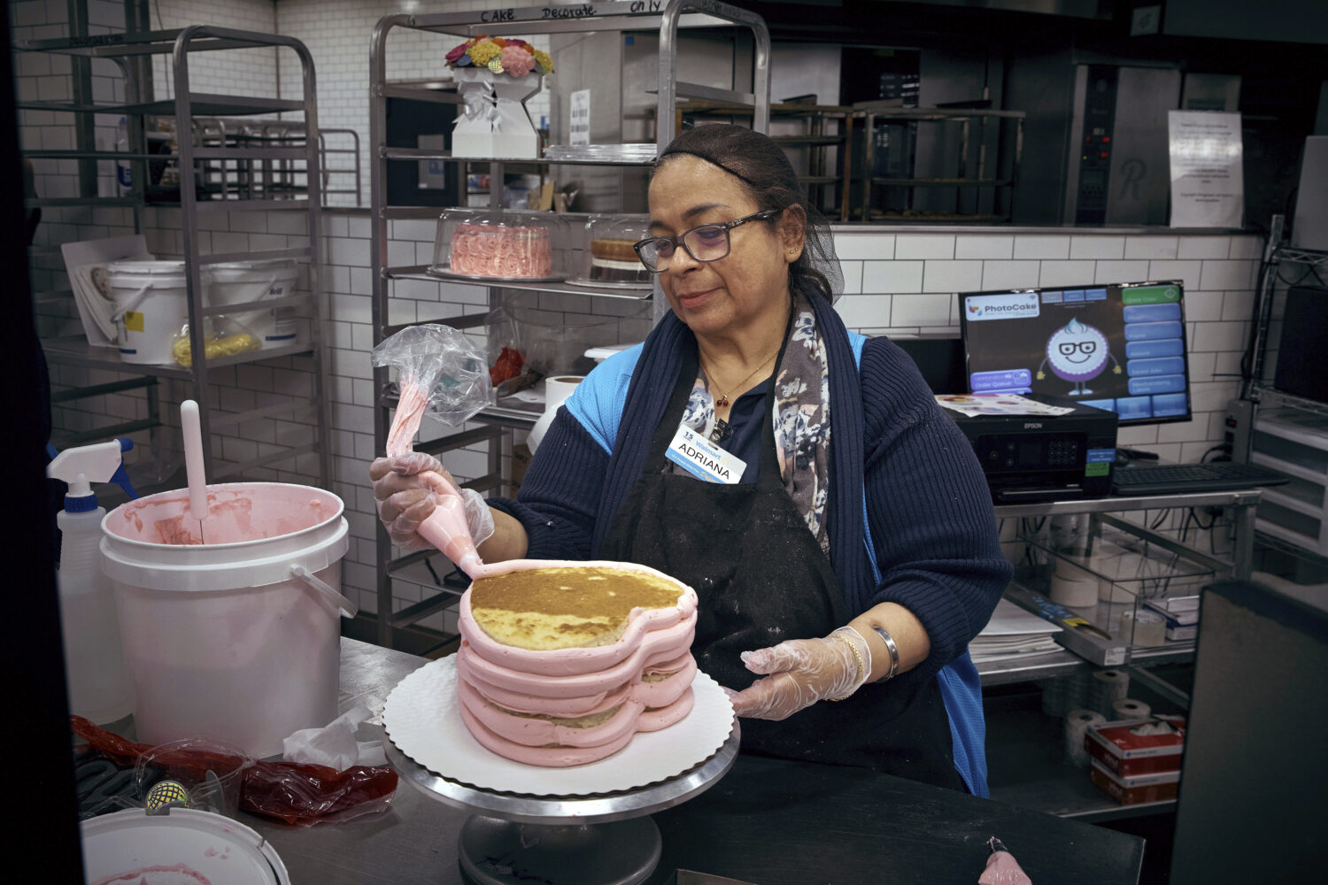 An employee makes a cake inside Walmart Supercenter on Wednesday, May 28, 2025, in North Bergen, N....