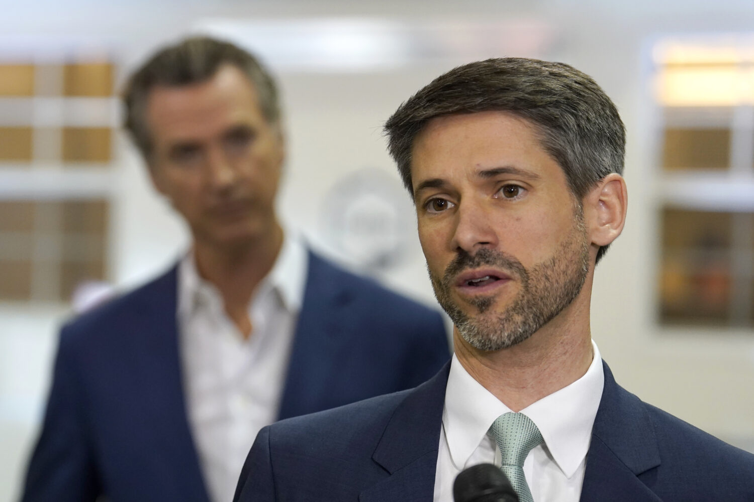 FILE - San Jose Mayor Matt Mahan, right, discusses California Gov. Gavin Newsom's, left, proposal t...