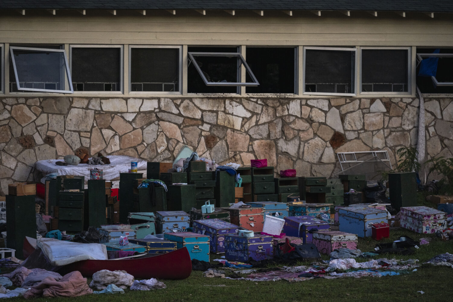 Campers belongings sit outside one of Camp Mystic's cabins near the Guadalupe River after a flash f...