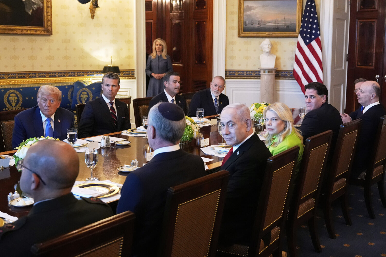 President Donald Trump, from back row left, Defense Secretary Pete Hegseth, CIA Director John Ratcl...