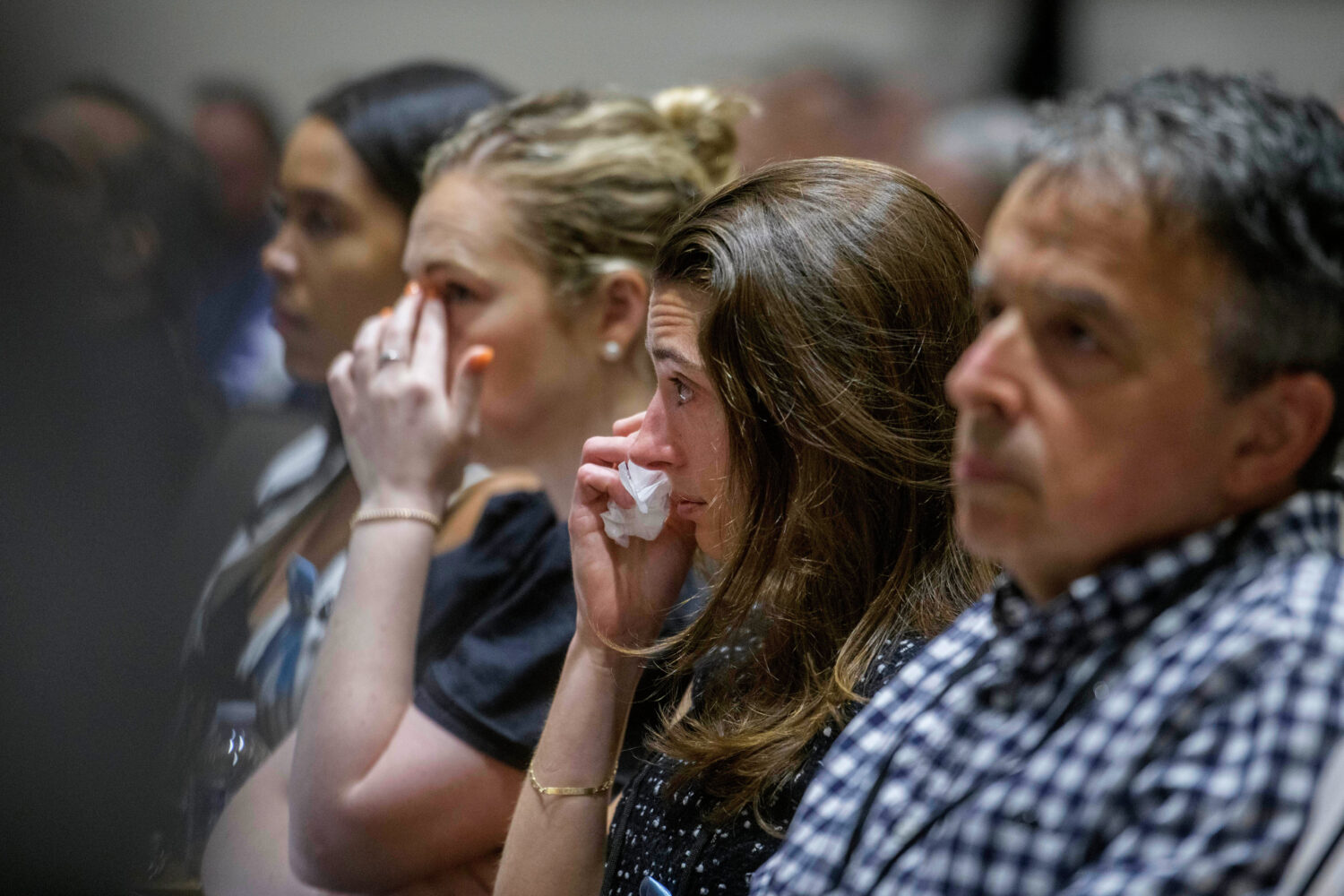 Family members of the victims of American Airlines flight 5342 who perished in a collision with a U...