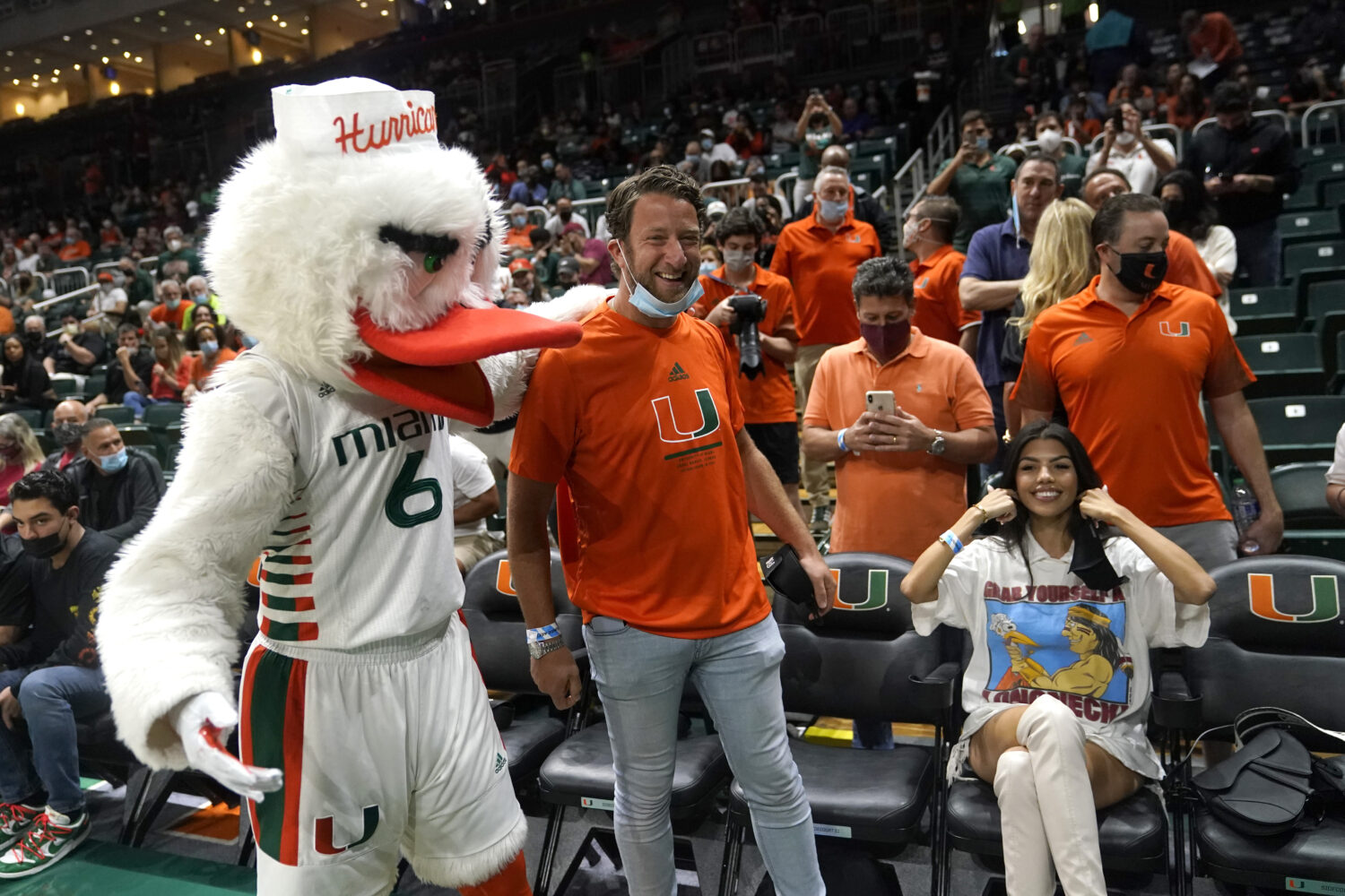 Barstool Sports blogger David Portnoy, center, poses with the Miami mascot Sebastian the Ibis durin...