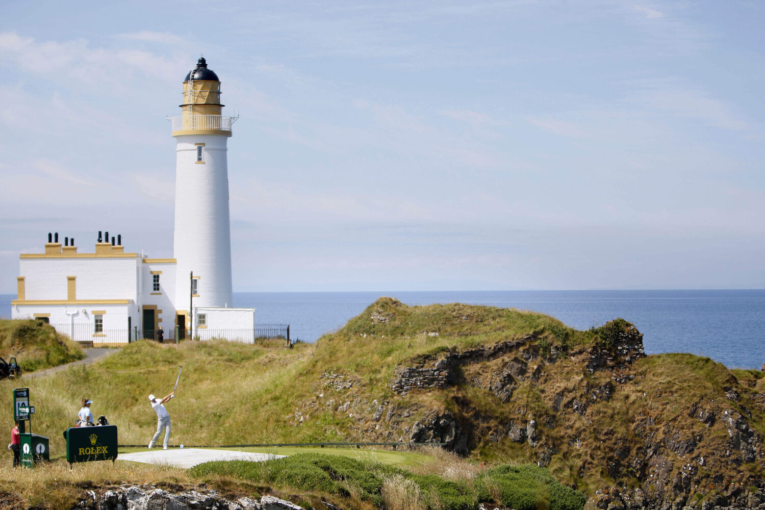 FILE - Sweden's Henrik Stenson tees off on the 10th hole with the Turnberry Lighthouse in the backg...