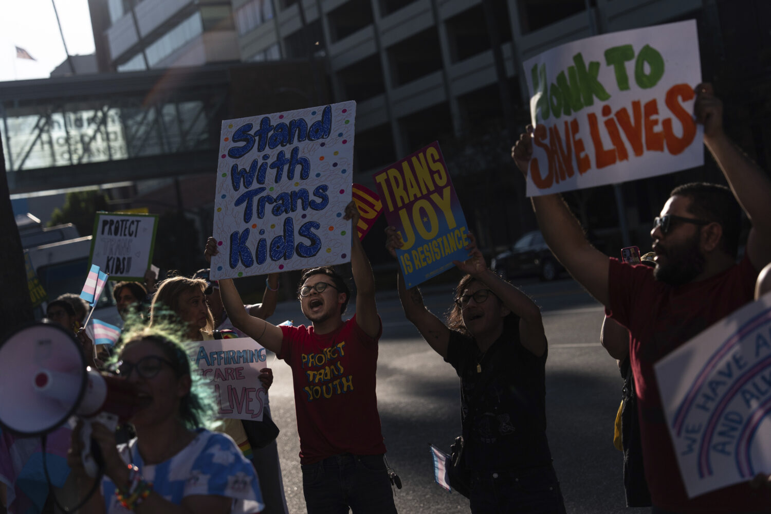 Protesters chant slogans while demonstrating against the closure of the trans youth clinic at Child...