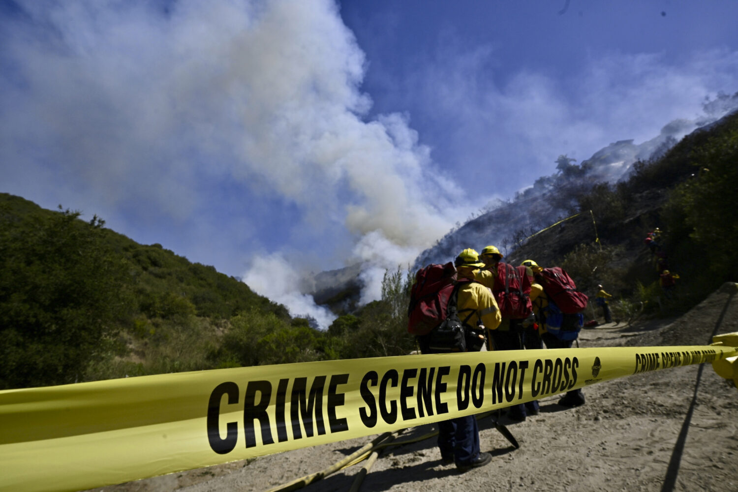 Smoke fills the sky as firefighters battle the Rancho Fire in Laguna Beach, Calif., on Monday, July...