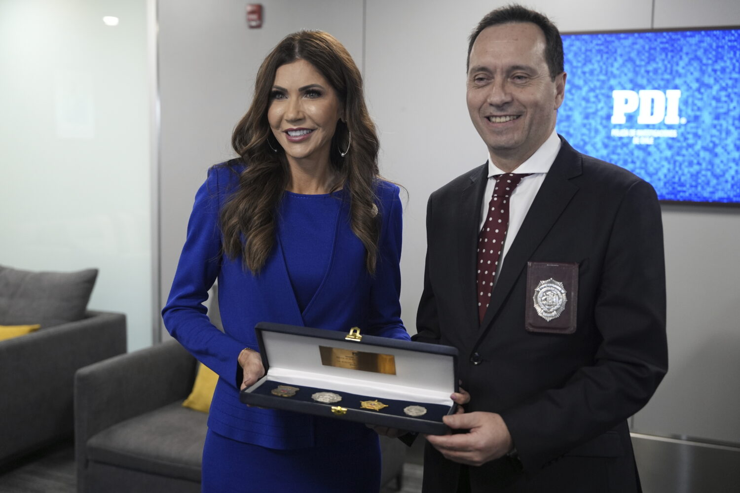 U.S. Homeland Security Secretary Kristi Noem, left, and Chile's Director of Investigative Police (P...