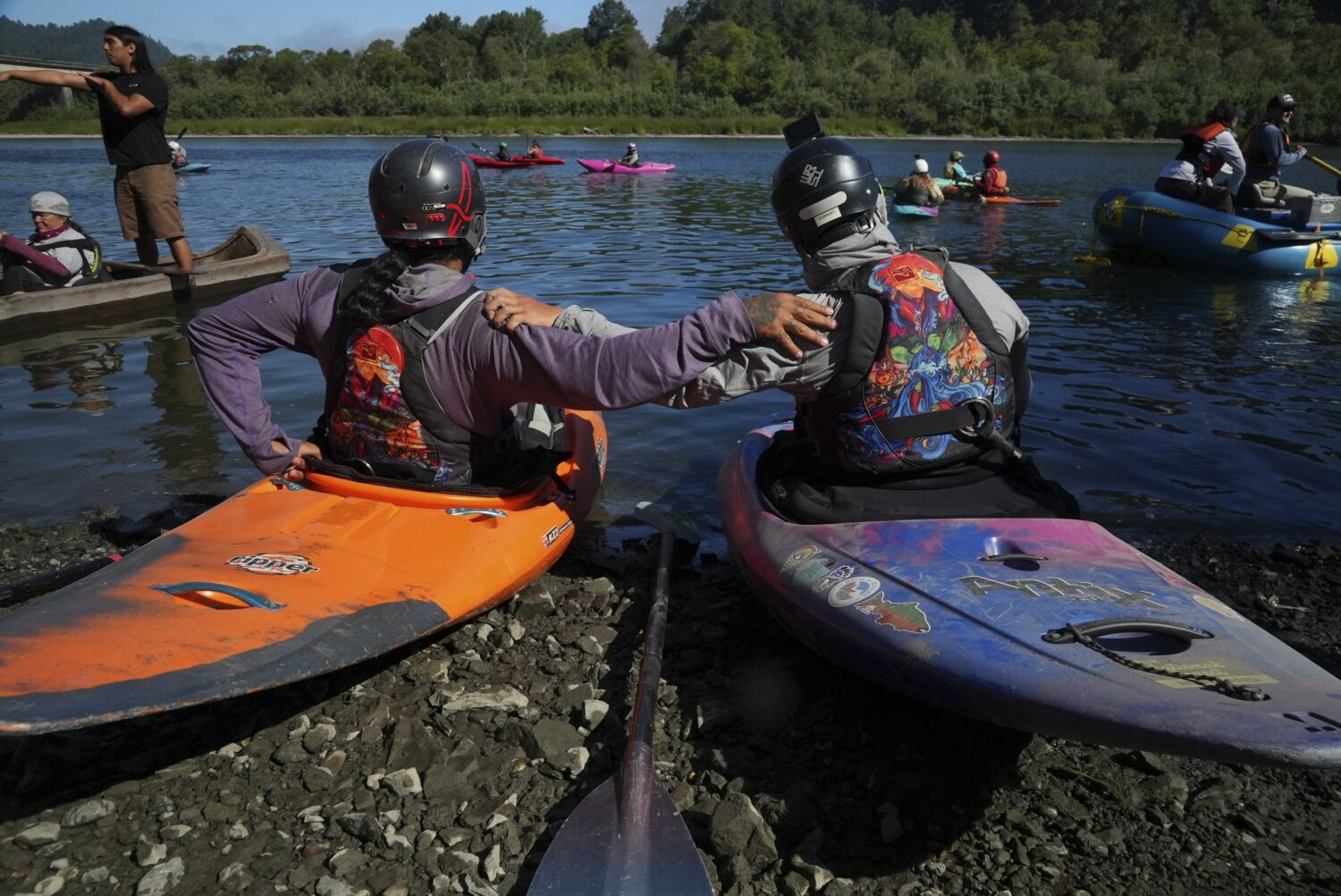 Kayakers pause before paddling the last couple of miles of the Klamath River to reach the Pacific O...