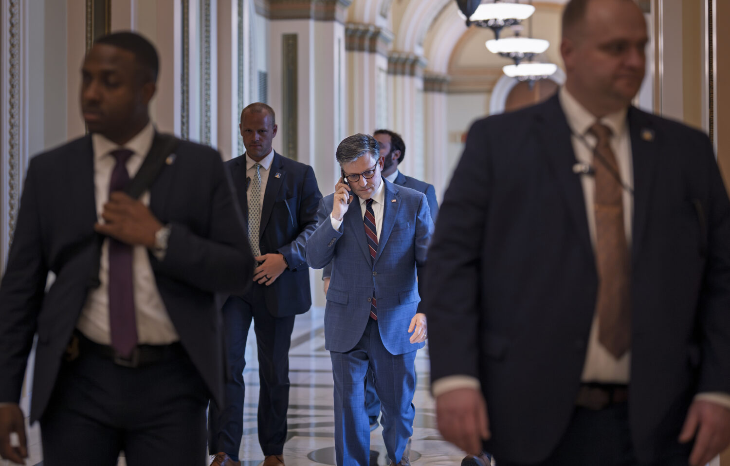 Speaker of the House Mike Johnson, R-La., leaves the chamber at the Capitol in Washington, Thursday...