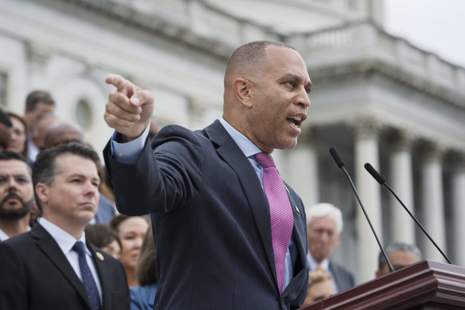 House Minority Leader Hakeem Jeffries, D-N.Y., and the Democratic Caucus, assemble on the steps of ...