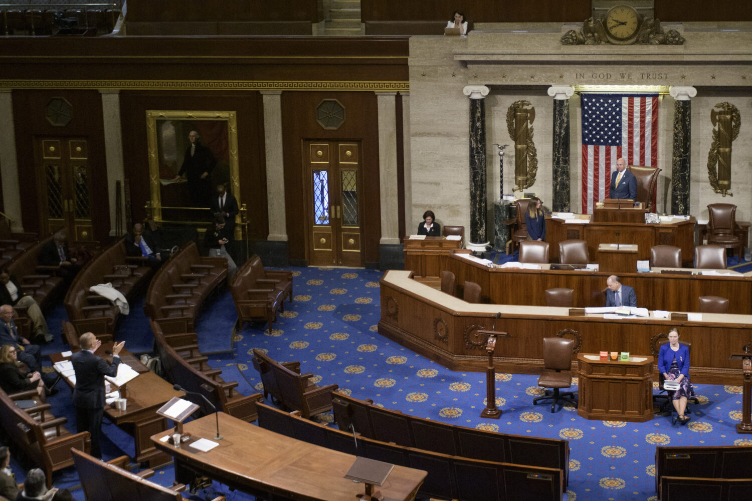 House Minority Leader Hakeem Jeffries, D-N.Y., left, speaks in the House chamber prior to the final...
