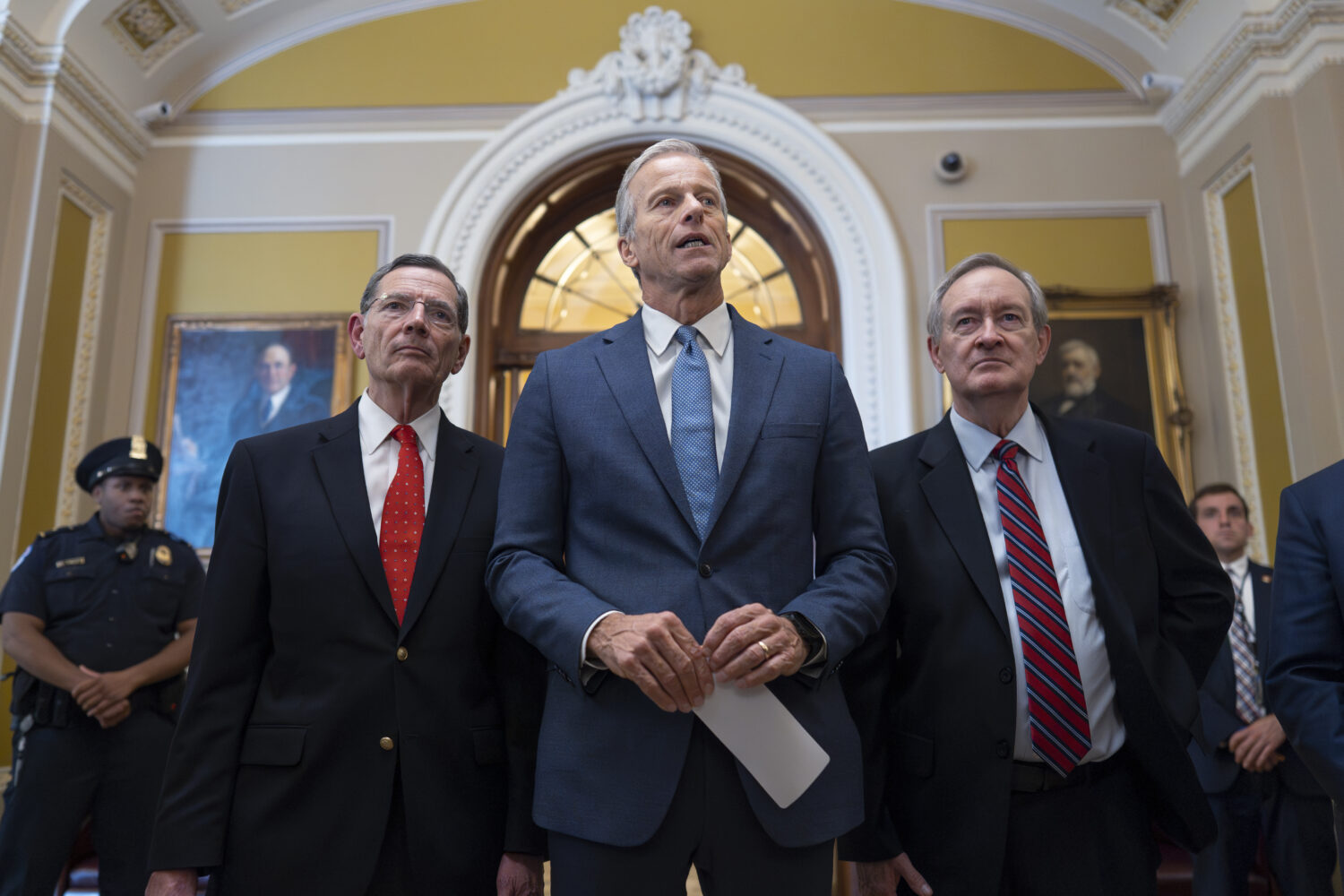 Senate Majority Leader John Thune, R-S.D., is flanked by Sen. John Barrasso, R-Wyo., the GOP whip, ...