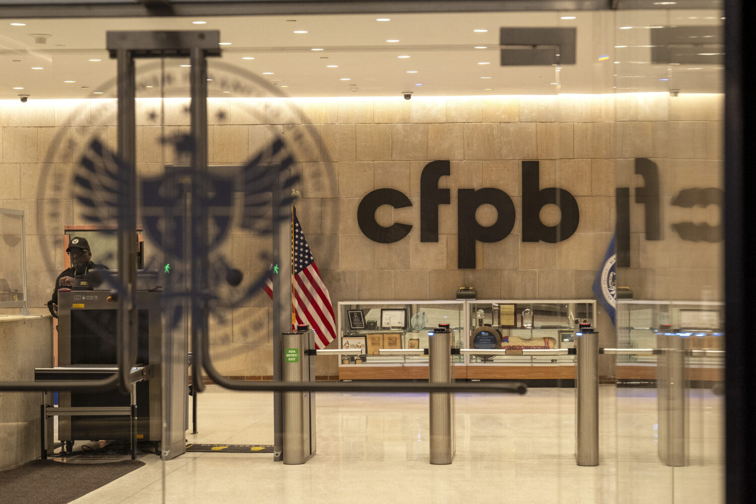 FILE - A security officer works inside of the Consumer Financial Protection Bureau (CFPB) building ...