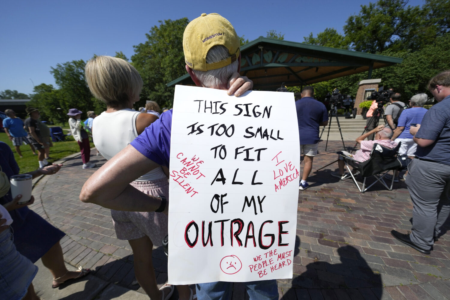 A local resident listen to a speech during an Iowa Democratic Party rally, Thursday, July 3, 2025, ...