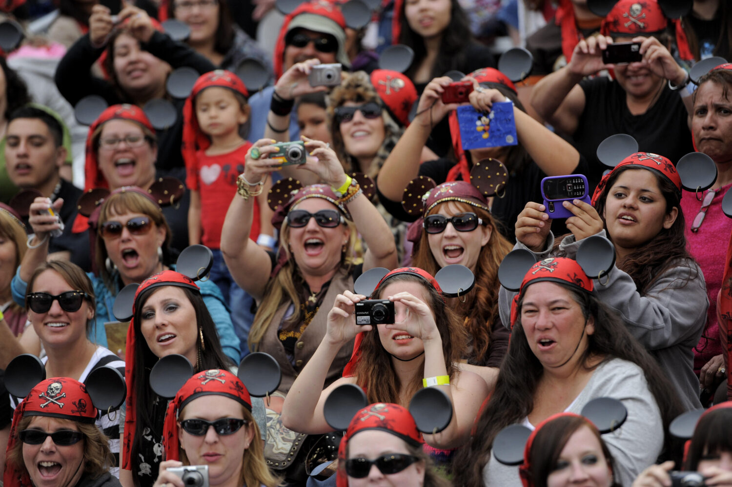 FILE - Fans cheer and take pictures as Mickey Mouse arrives at the World Premiere of "Pirates of th...