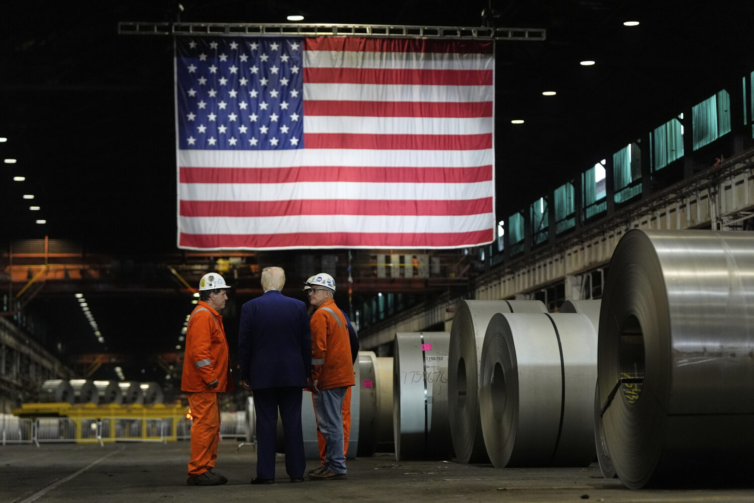 FILE - President Donald Trump talks to workers as he tours U.S. Steel Corporation's Mon Valley Work...