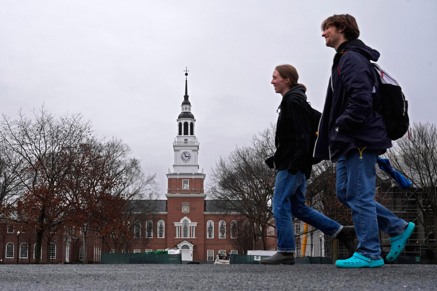 FILE - Students cross the campus of Dartmouth College, March 5, 2024, in Hanover, N.H. (AP Photo/Ro...