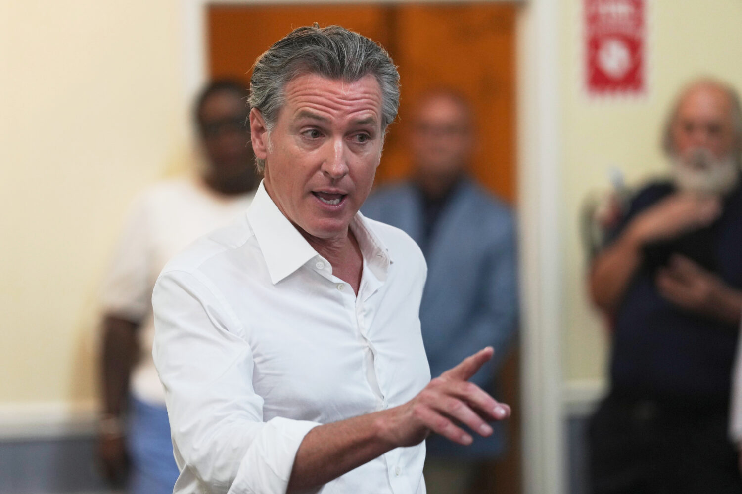 Gov. Gavin Newsom, R-Calif., speaks to a crowd gathered at an event space during a two-day swing th...