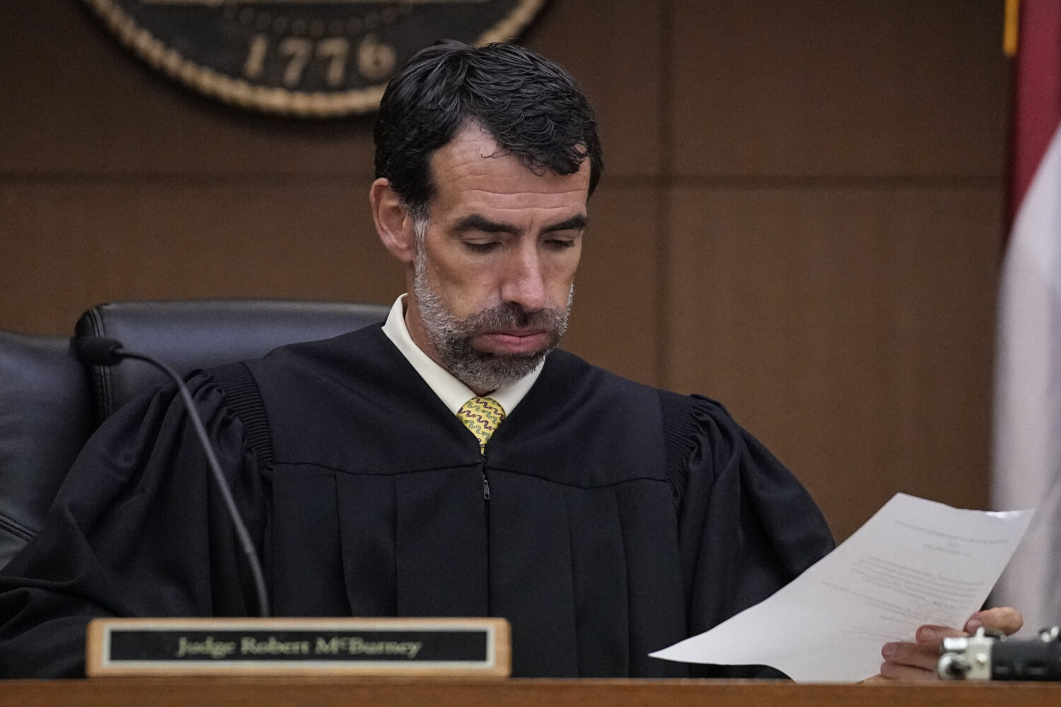 FILE - Fulton County Superior Court Judge Robert McBurney looks through paperwork, Aug. 14, 2023, i...