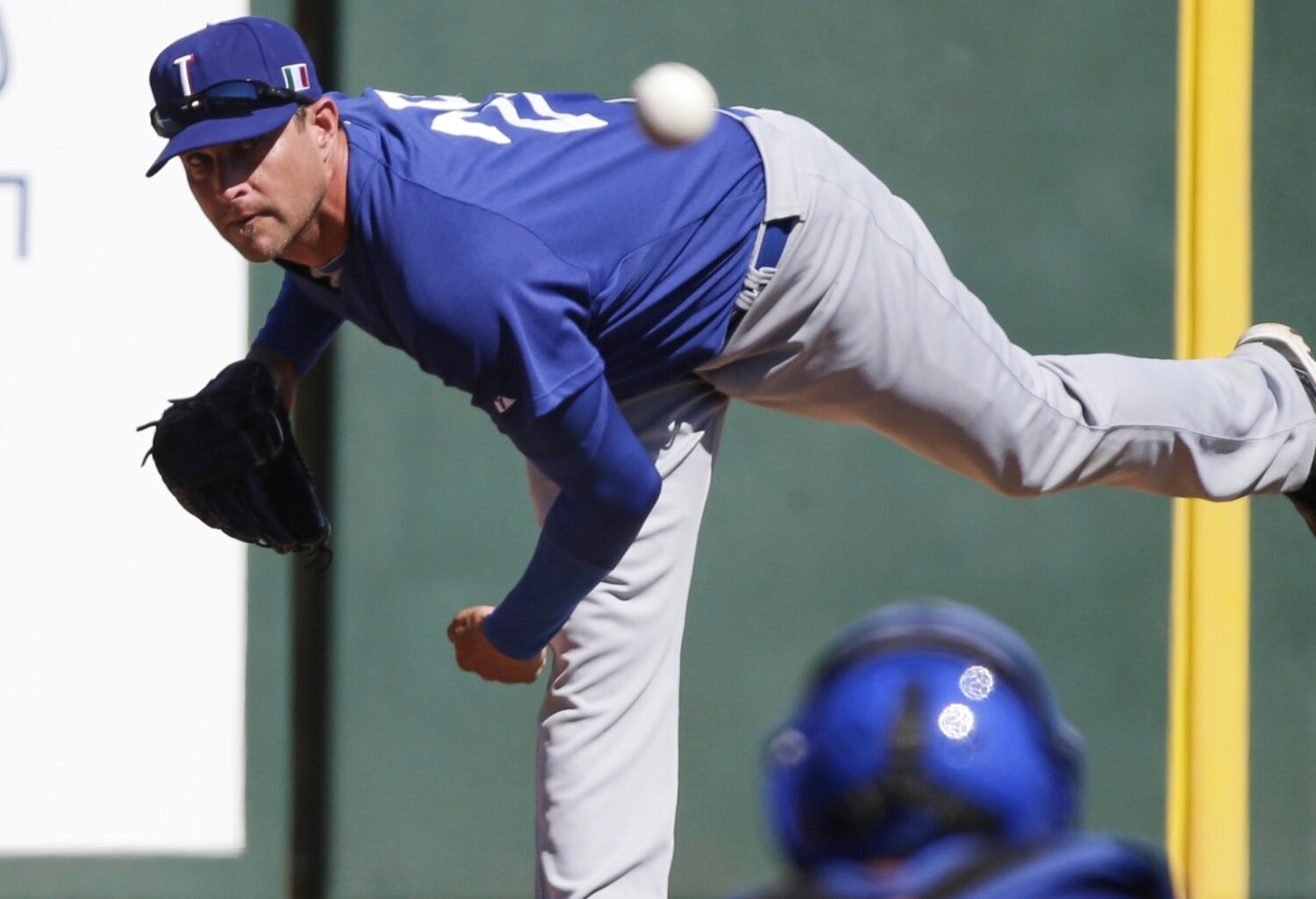 FILE - Italy's Dan Serafini throws before the first inning of an exhibition spring training basebal...