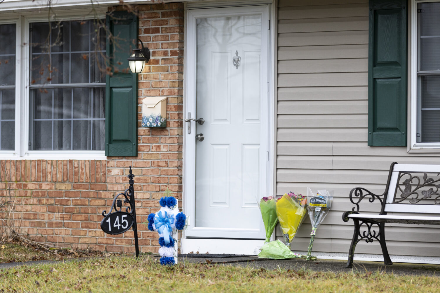 FILE - Flowers rest at the front door of the Mohn residence in Upper Orchard section of Levittown, ...