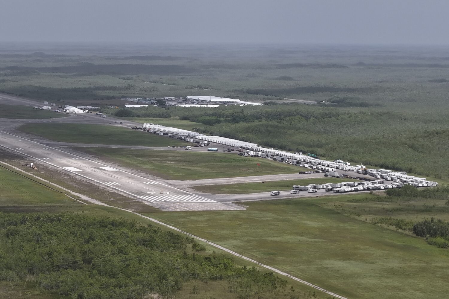 This aerial photo shows that the state is plowing ahead with building a an immigration detention fa...