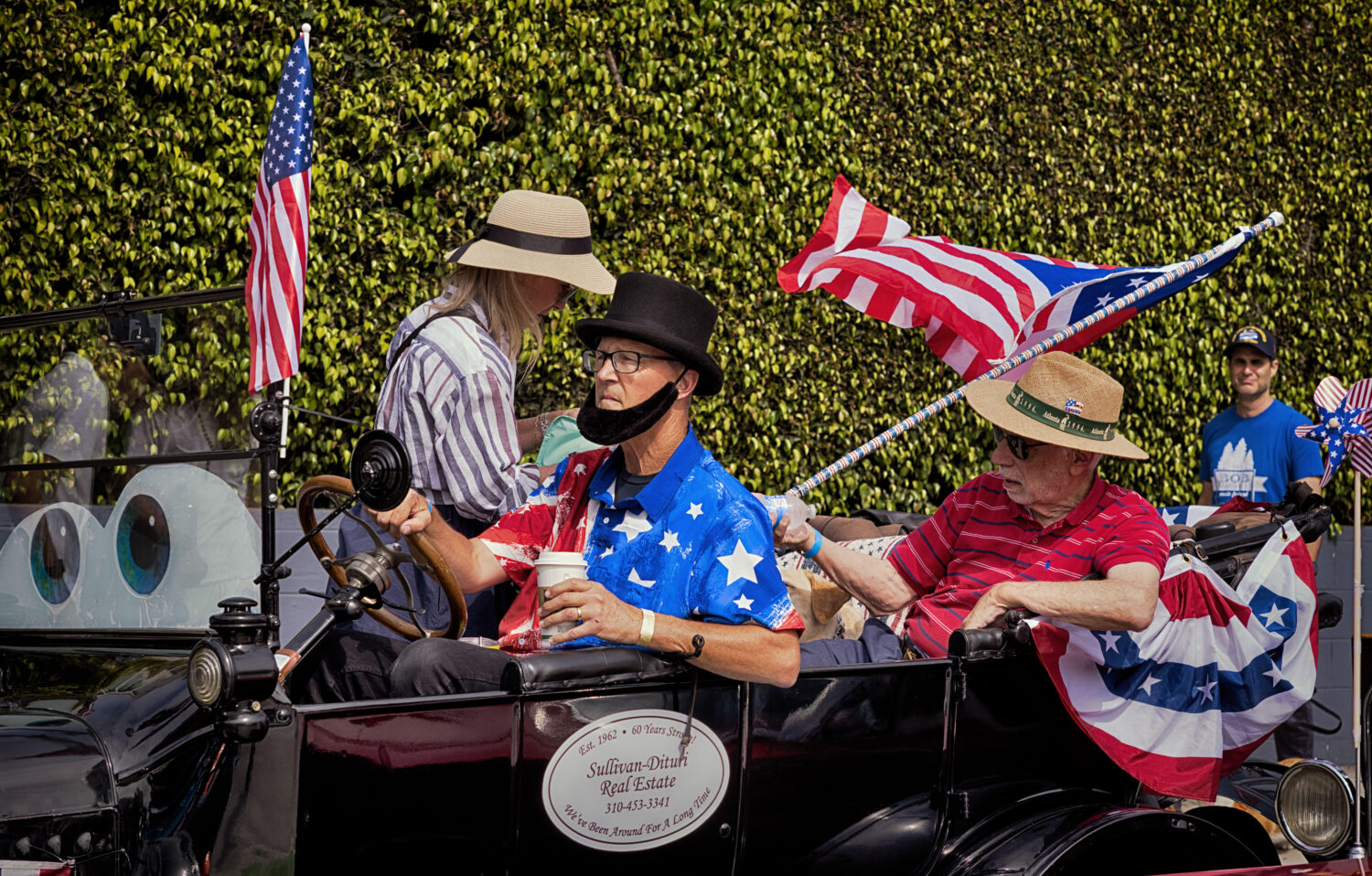 Participants in an antique car prepare to take part in the Independence Day Parade in Santa Monica,...