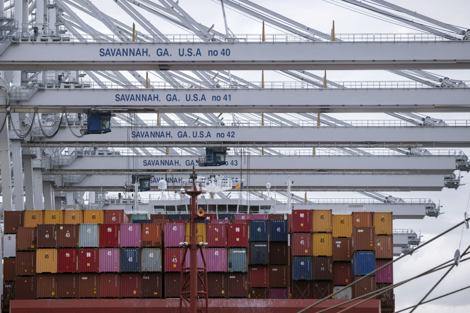 FILE- In this photo provided by the Georgia Ports Authority, a vessel is loaded with containers by ...
