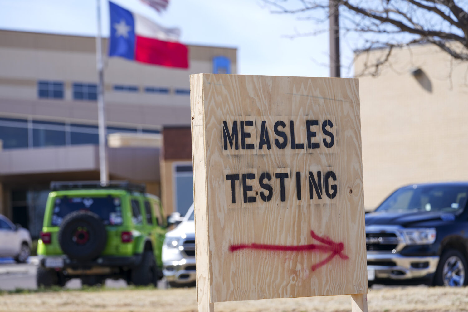 FILE - A sign is displayed outside the Seminole Hospital District offering measles testing, Feb. 21...