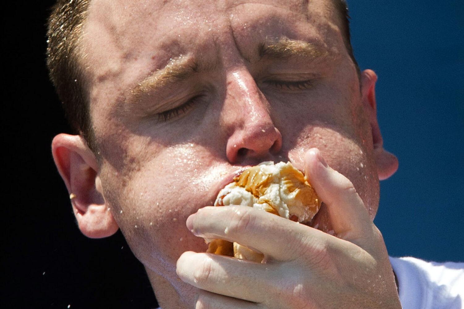 FILE - Five-time reigning champion Joey Chestnut competes in the Nathan's Famous Hot Dog Eating Wor...