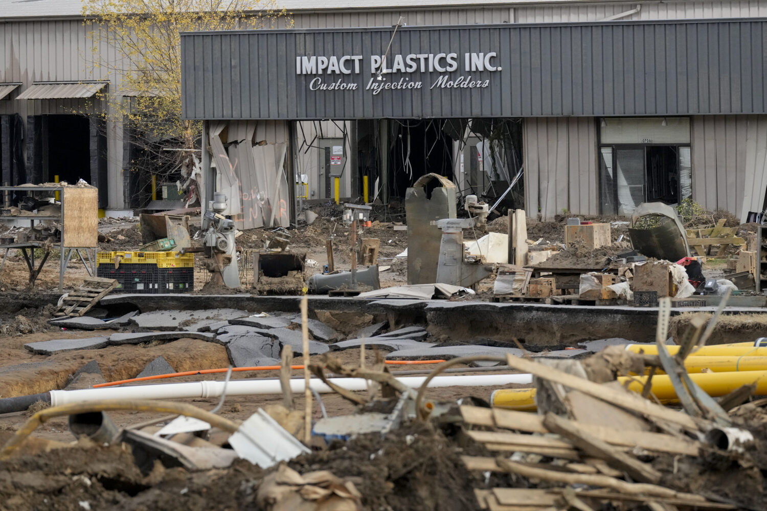 FILE - Debris lays in front of Impact Plastics Inc. in Erwin, Tenn., Nov. 22, 2024. (AP Photo/Georg...