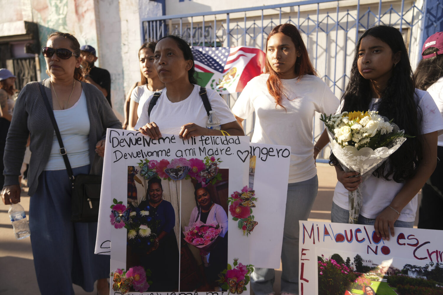Family members demand the return of immigrant Emma de Paz, who was detained by ICE agents outside a...
