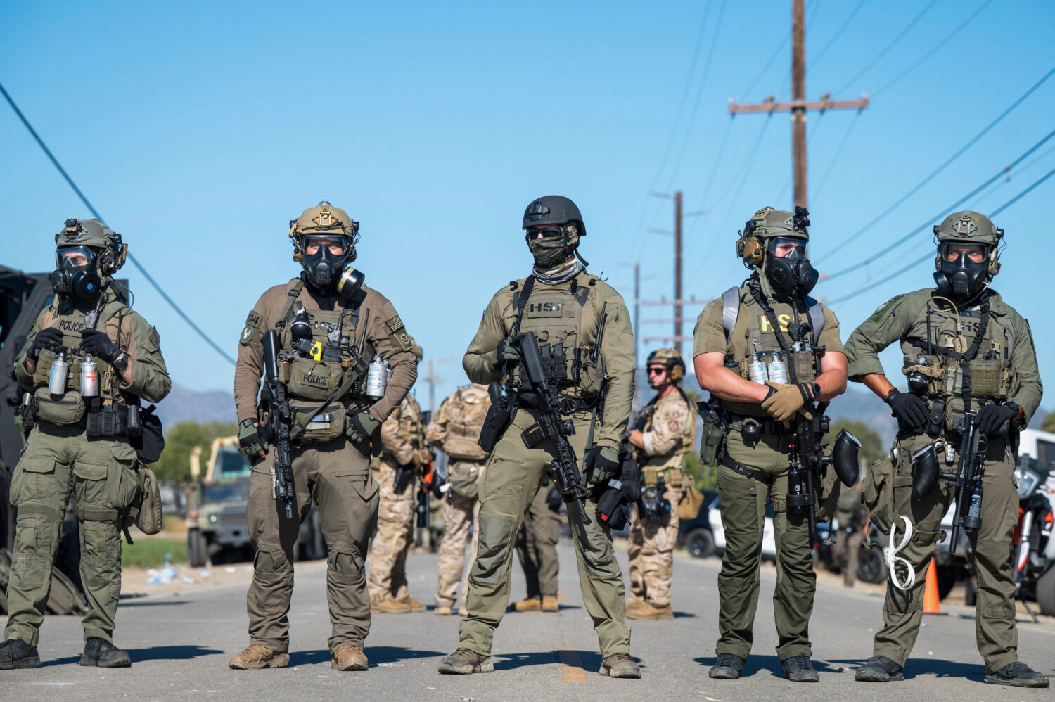 Federal immigration agents block the road during a raid in the agriculture area of Camarillo, Calif...