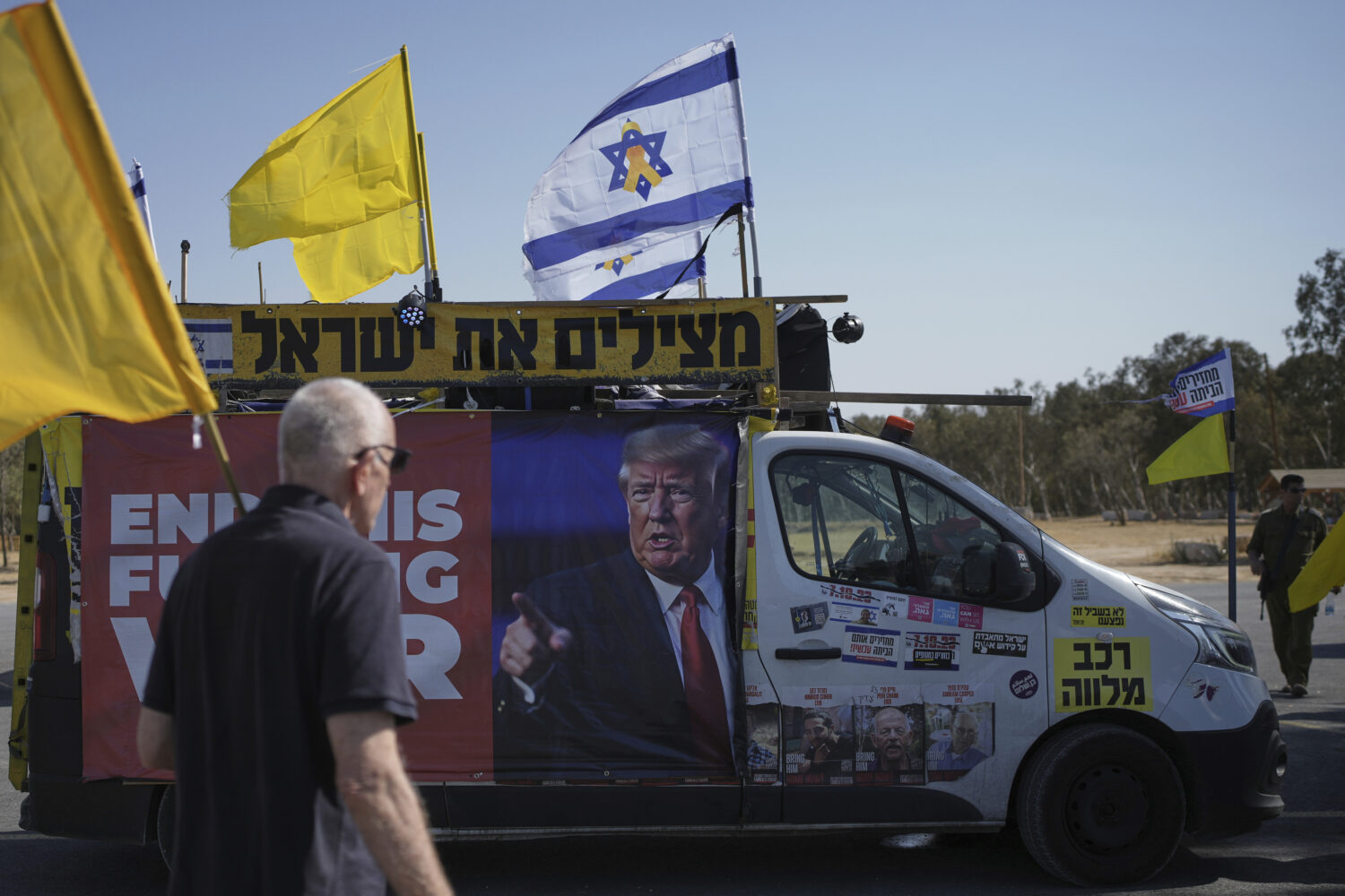 People take part in a protest demanding an end to the war and the immediate release of hostages hel...