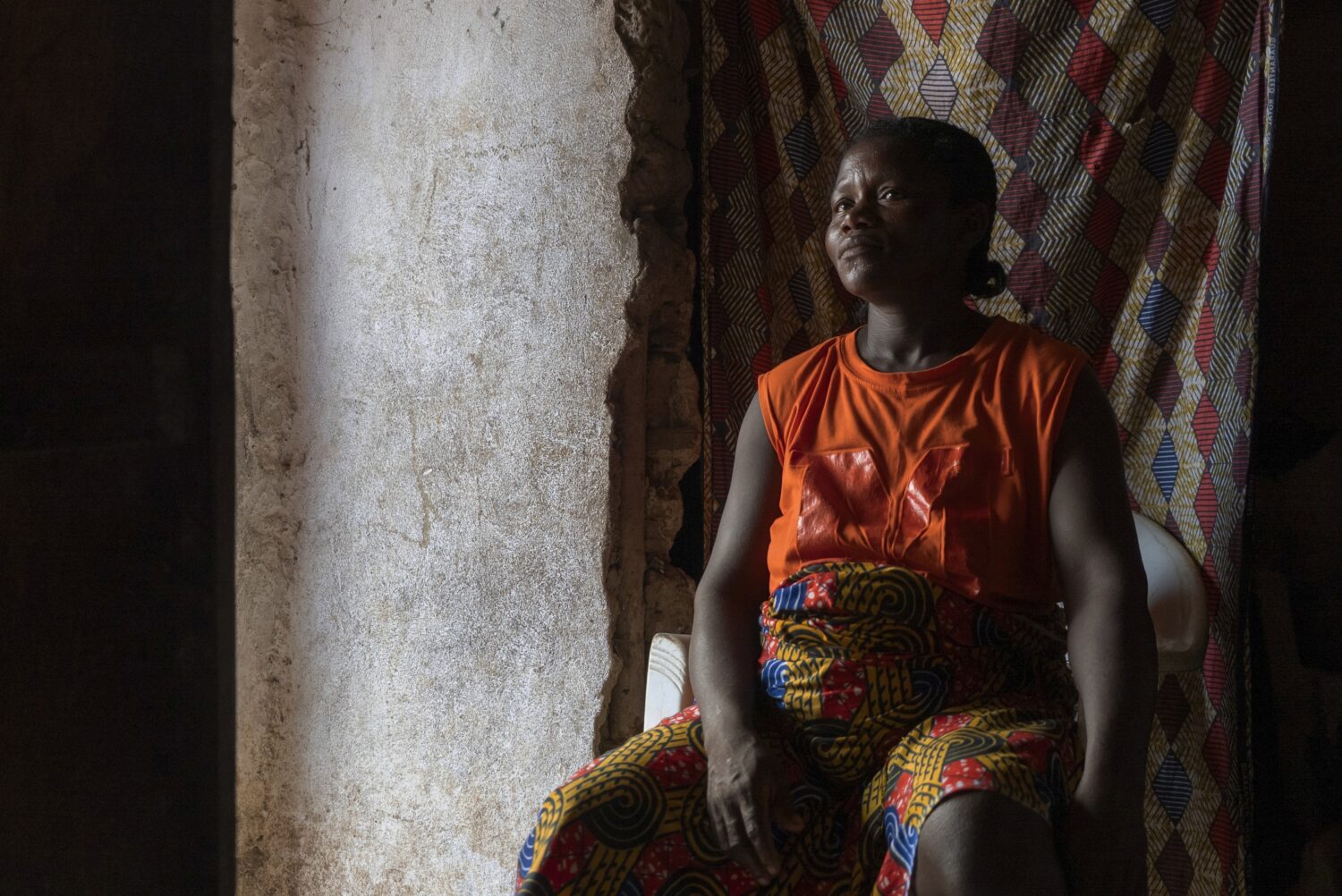 Gbango Kemu, 36, who got pregnant after failing to get access to contraceptives, sits with her daug...