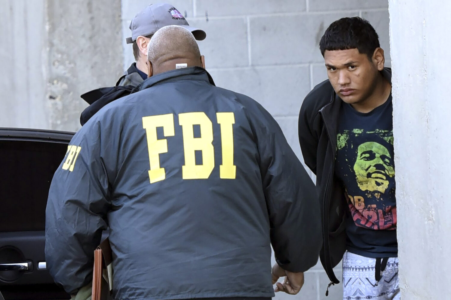 FILE - In this Thursday, March 2, 2017 photo, accused MS-13 gang member Alexi Saenz, is escorted by...