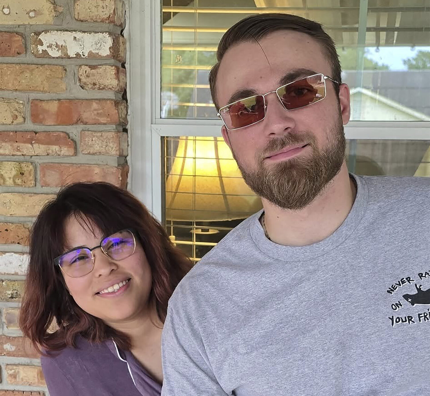 FILE - Adrian Clouatre takes a selfie of himself and his wife Paola, on May 26, 2024 in Baton Rouge...