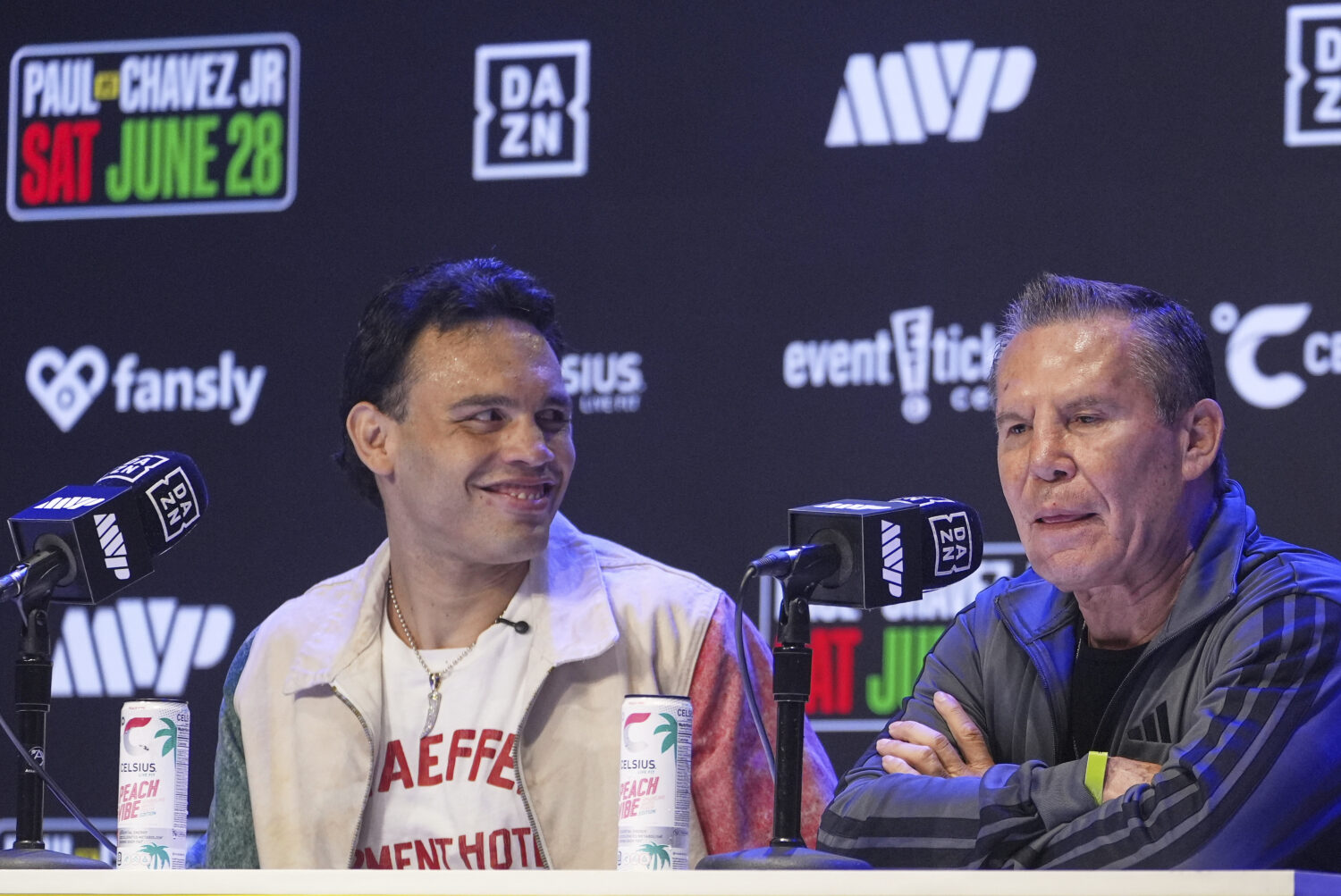 FILE - Boxers Cesar Chavez Jr,, left, smiles towards his father Julio Cesar Chavez, Mexico's former...