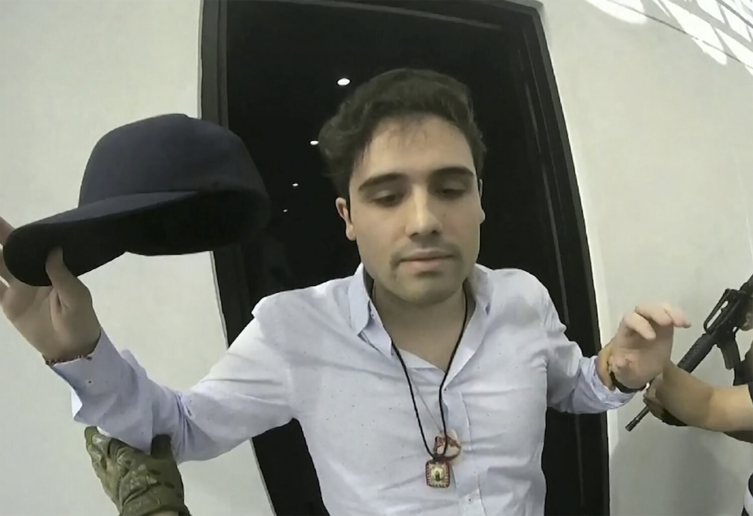 FILE - This frame grab from video, provided by the Mexican government, shows Ovidio Guzman Lopez be...
