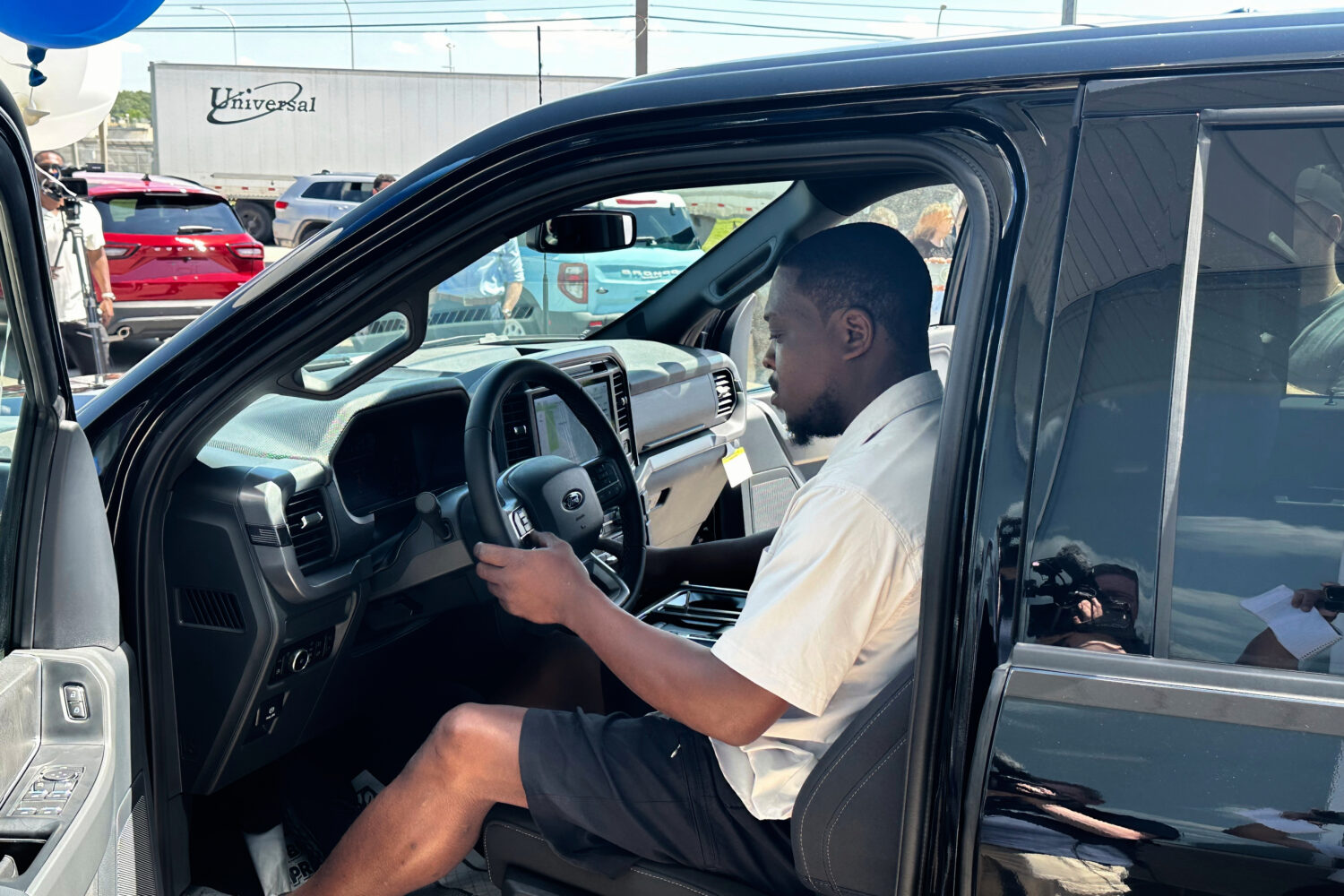 Richard Pryor sits behind the wheel of a new 2025 Ford F-150 pickup at a Ford dealership Thursday, ...
